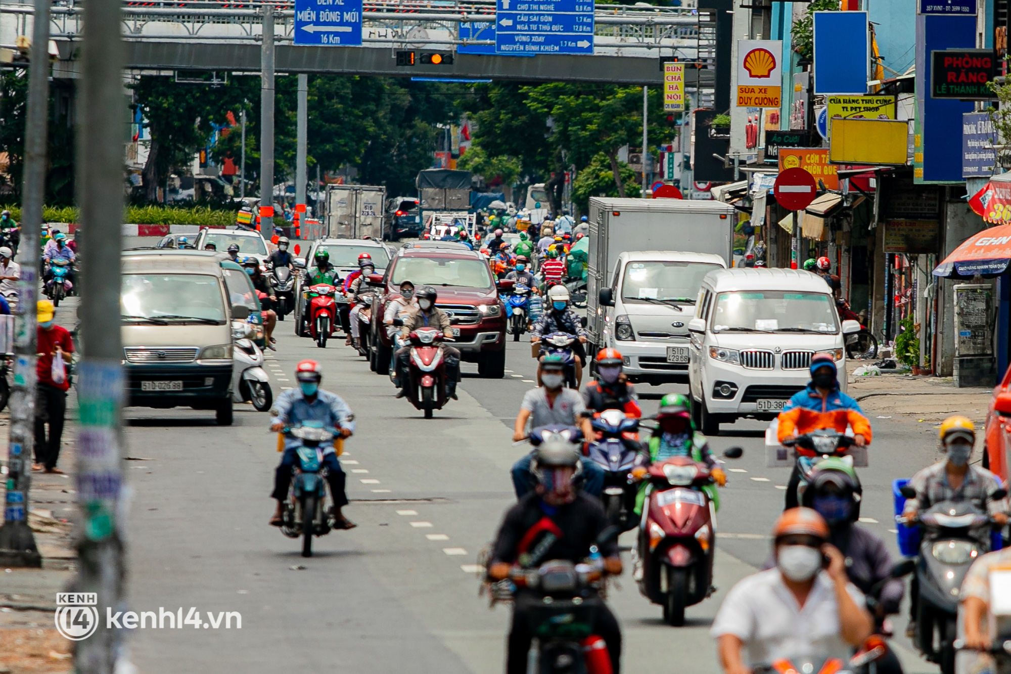 A bustling street corner in Hanoi or Saigon—vendors, buyers, motorbikes, the pulse of life