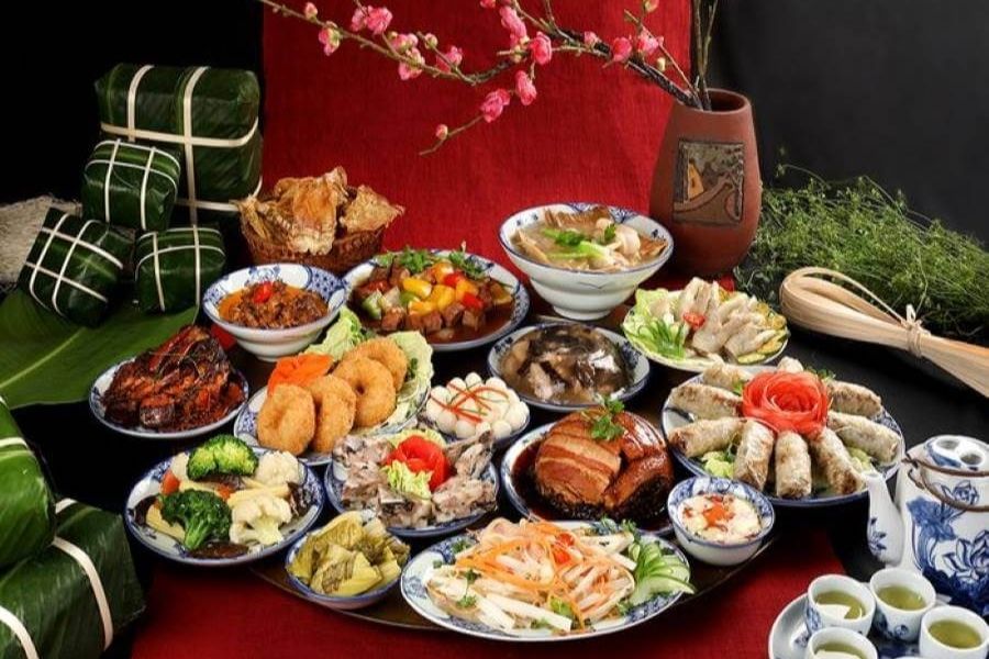 A traditional Northern Tết feast complete with bánh chưng, giò, and nem