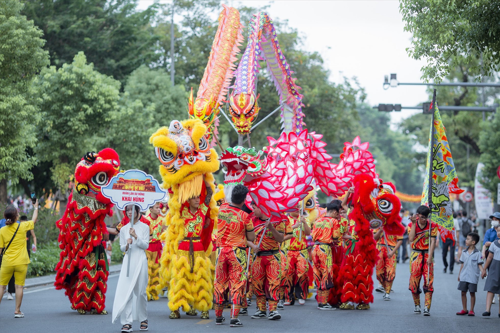 A Mid-Autumn lion dance on the street — a vividly colored lion troupe, deafening drums and cymbals