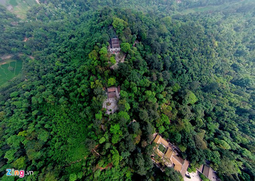 The Hung Temple on Nghia Linh mountain viewed from afar — ancient architecture enveloped by lush greenery