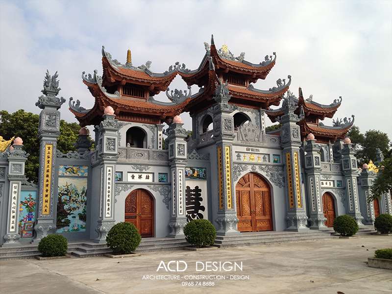 The traditional three-entrance gate (cổng tam quan) of a Vietnamese pagoda — curved roof, ancient trees