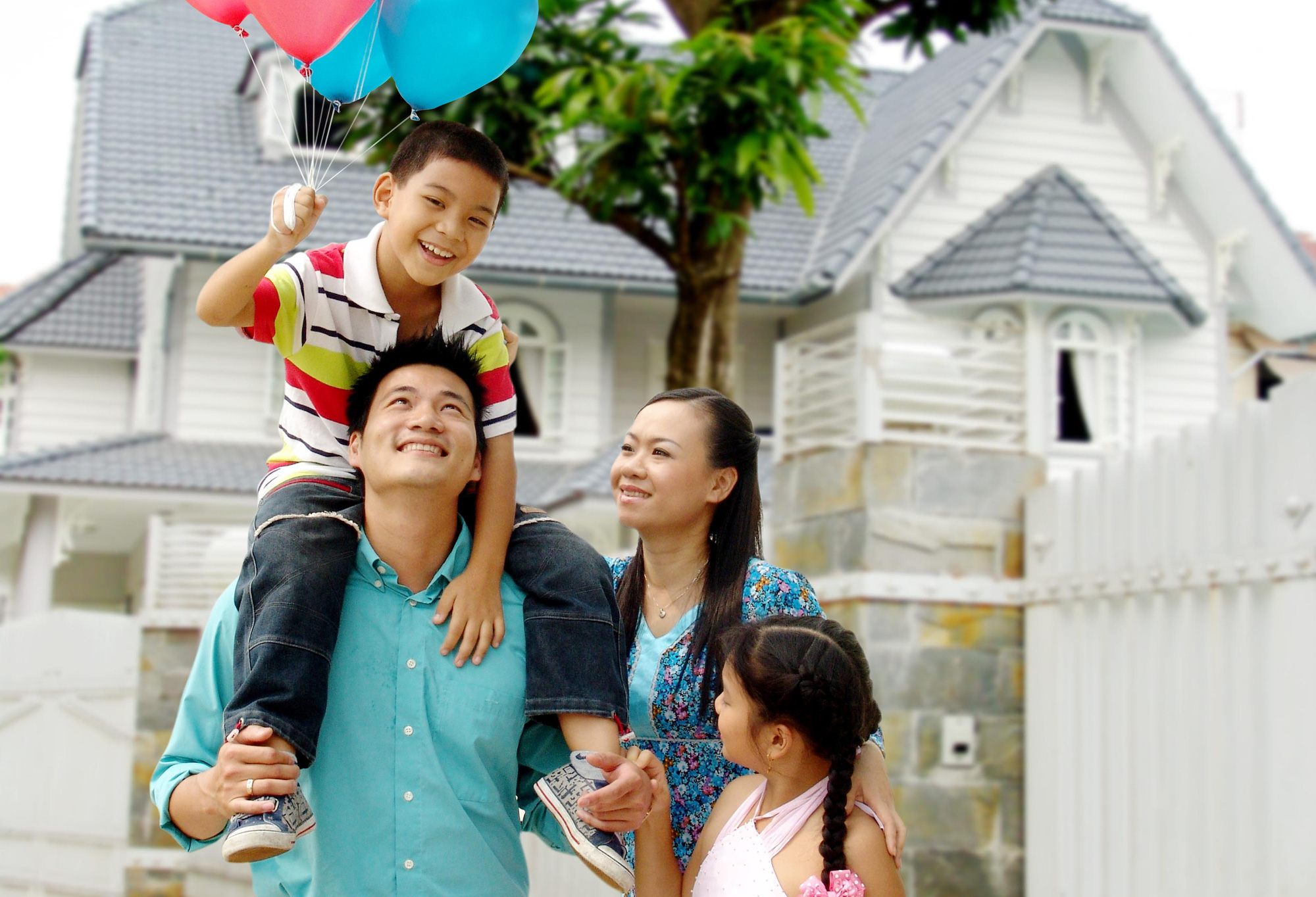 A Vietnamese family in a public space — neatly dressed, poised, projecting self-respect
