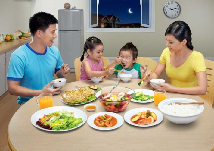 A young Vietnamese couple engaged in a calm, serious discussion at the dining table — representing negotiation