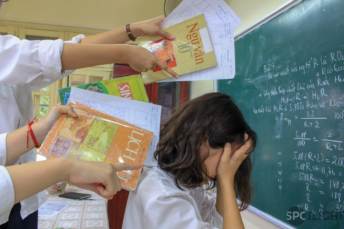 A young Vietnamese person with an exhausted and pressured expression — the stress of expectations