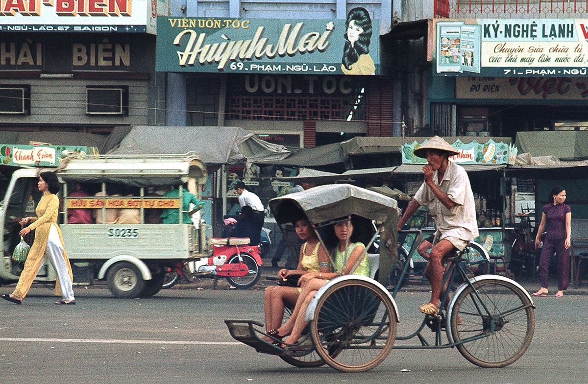 The economic landscape of Saigon in the 1990s beginning to revive — bicycles yielding to motorcycles