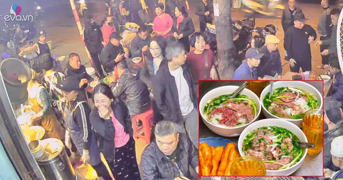 Hanoians lining up in a massive crowd in front of a Pho stall early in the morning — from 5–6 AM