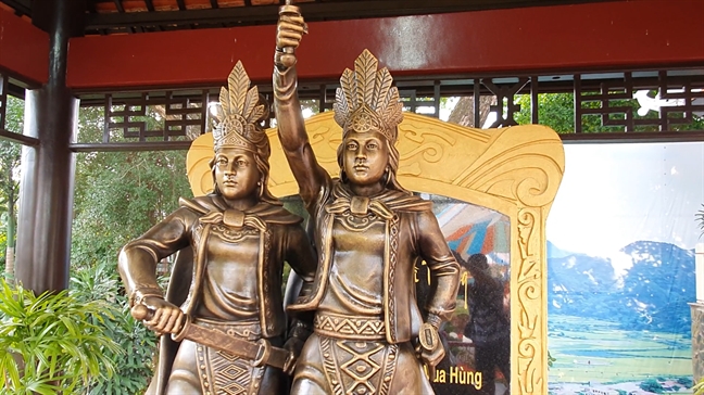 A statue of the Trung Sisters — two imposing women riding war elephants