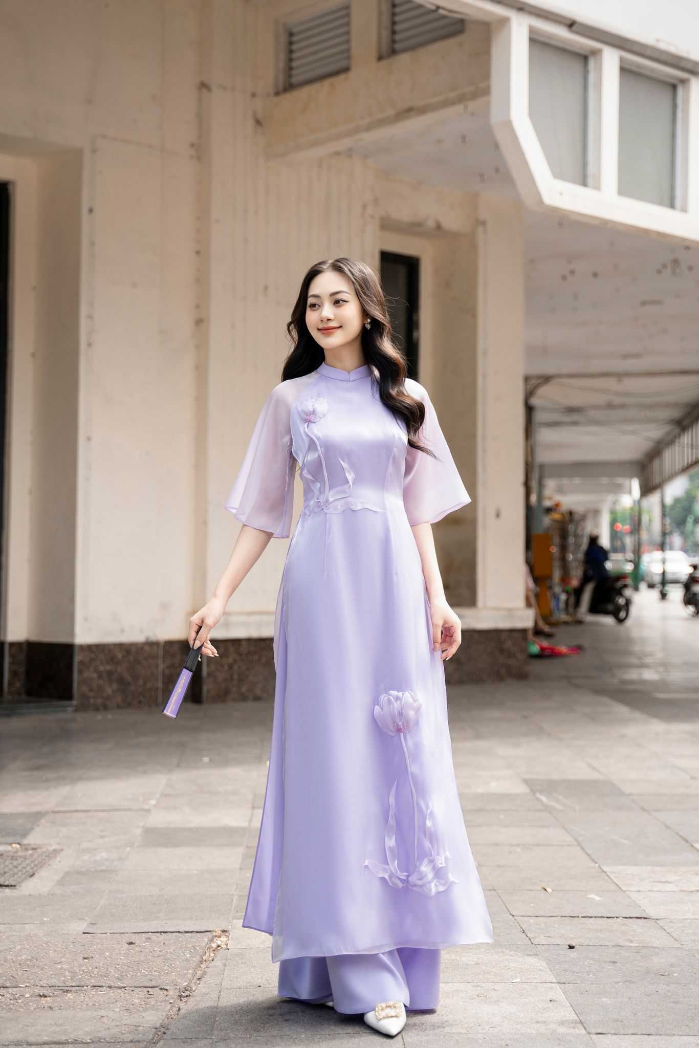 Gen Z Vietnamese wearing modern, stylized Ao Dai — unique, non-rigid fashion — diverse aesthetic expressions
