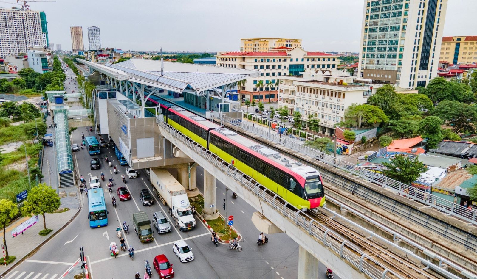 A newly launched Hanoi Metro station — pristine, hyper-modern — but the massive flow of motorbikes continues outside