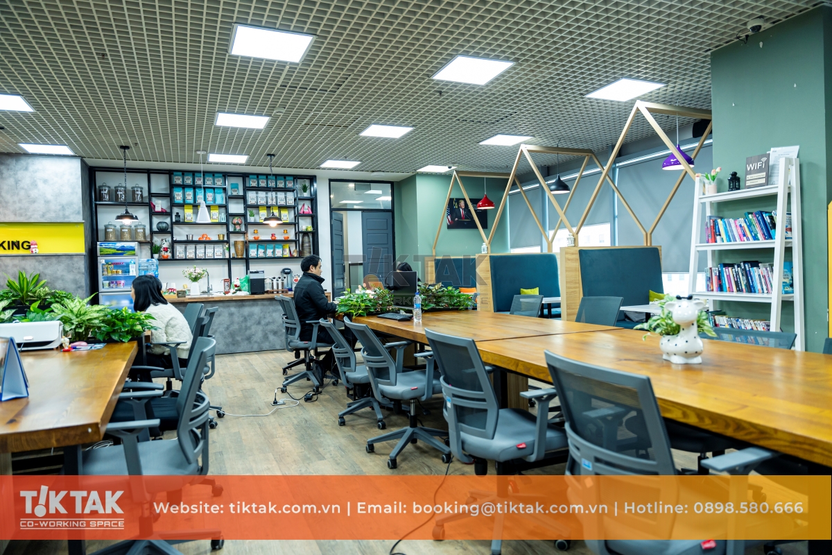 A modern Vietnamese startup office — young developers operating in a dynamic, high-energy environment