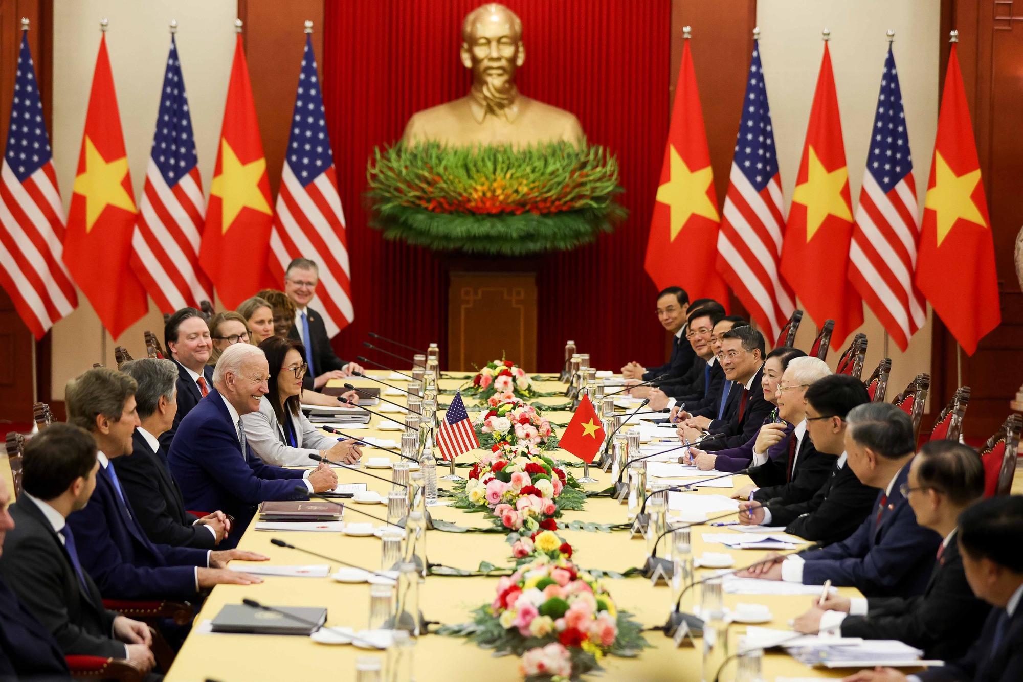 A strategic development conference in Vietnam — politicians, economists, and national flags