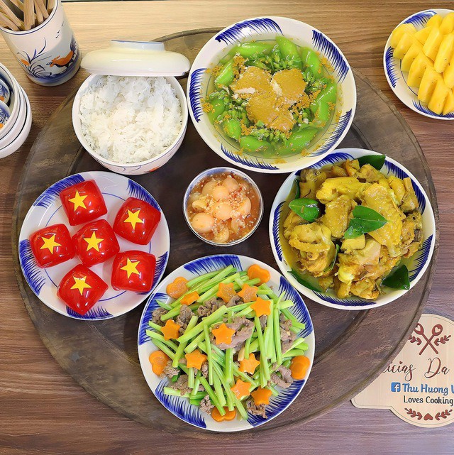 A traditional Vietnamese family meal executing within a hyper-modern urban apartment — tradition and modernity operating simultaneously