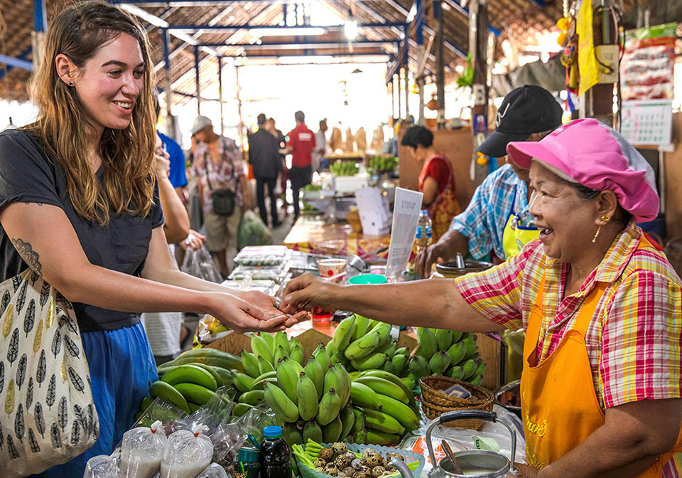 Vietnamese street market negotiating bargaining smiling vendor